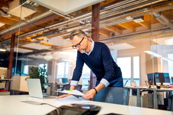 Man is reading papers
