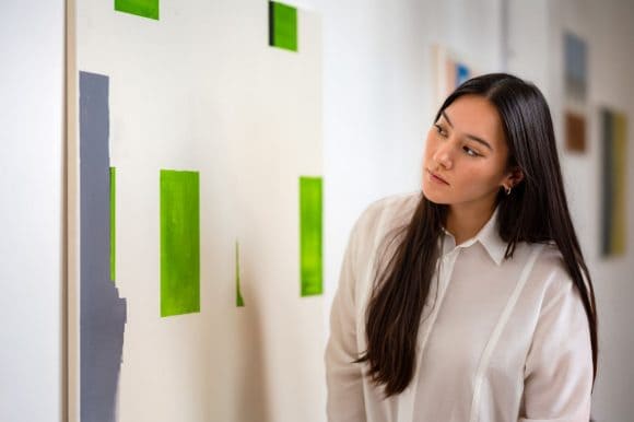 Woman looking at painting