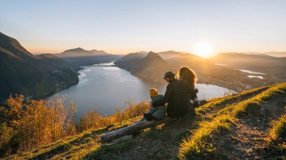 Family on mountain top overlokking lake lugano