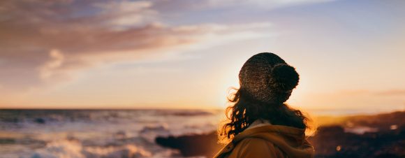 Woman at sea in autumn