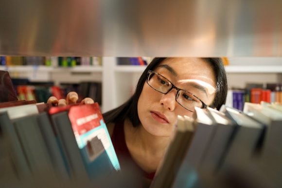 Woman seeing books