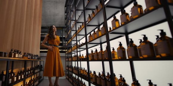 Woman watching a botles in store