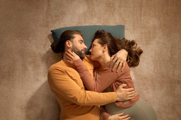 Woman and man in boat float on water