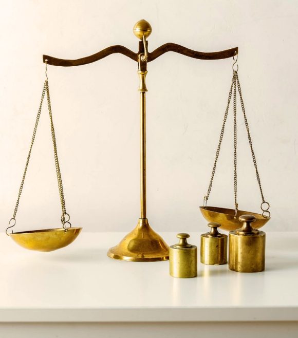 Table with scale and three weights.