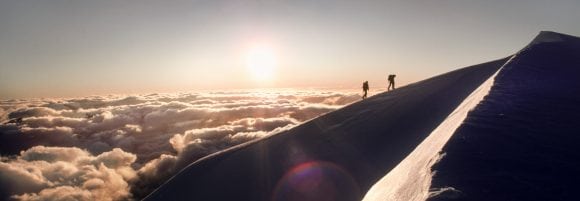 Mountaineers climbing mountain