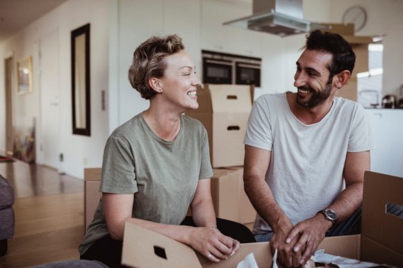 A couple moving into a house