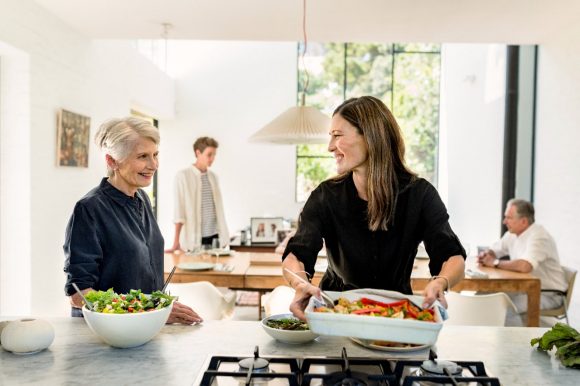 Two women in kitchen preparing meal