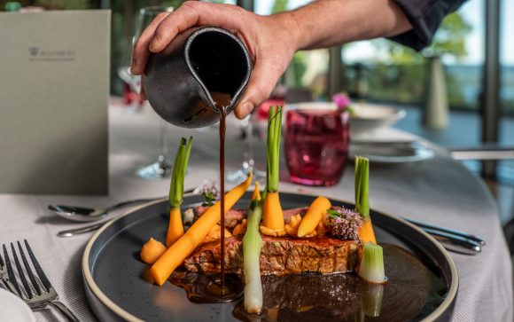 Main course with meat, carrots, and sauce