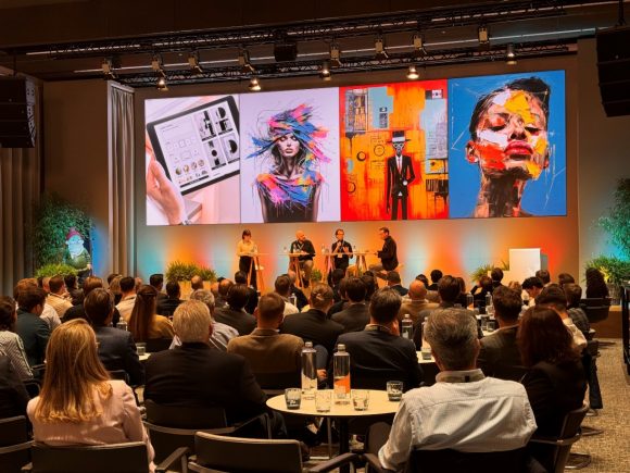 Image from a WD event with guests, with a view of the stage and the on-stage guests.