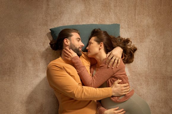 Woman and man in boat float on water