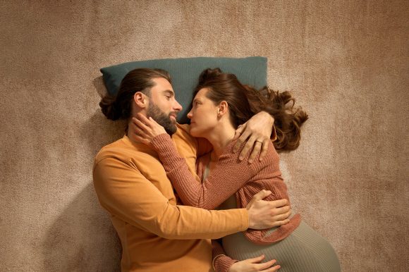 Woman and man in boat float on water