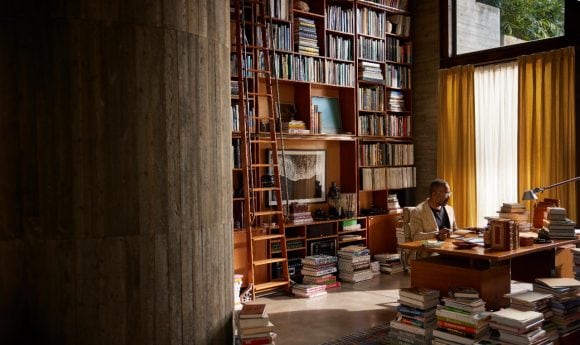 Man reading books in a library
