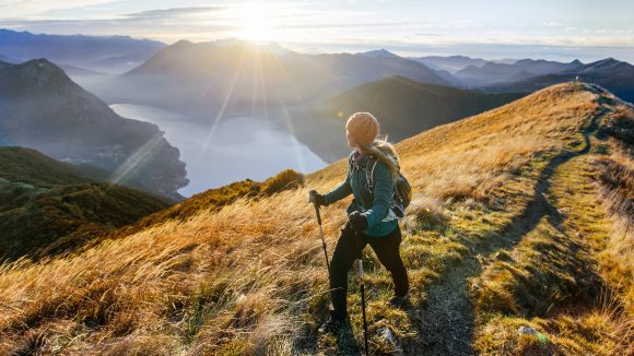 Woman hiking along mountain ridge