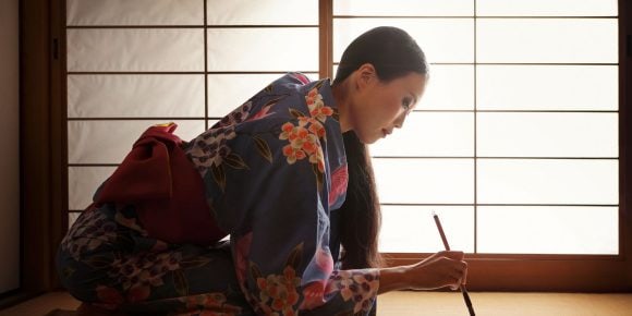 Japanese woman doing calligraphy