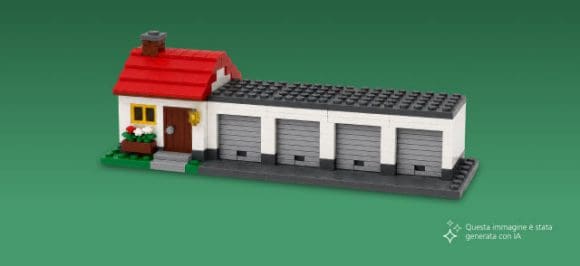 Nell’immagine si vede una piccola casa unifamiliare con quattro garage su uno sfondo verde.