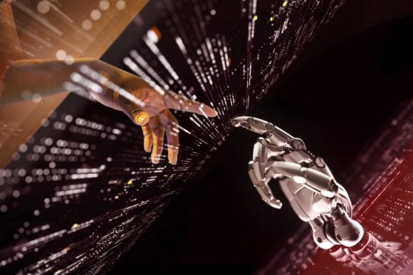 Human hand touching robotic hand