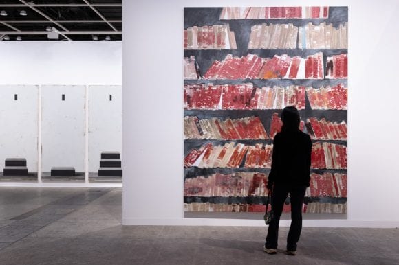 Birdseye view of the showfloor at Art Basel Hong Kong 2025, showing art fair booths, artworks and visitors.