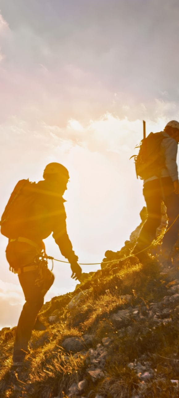 A group of people climbing a mountain