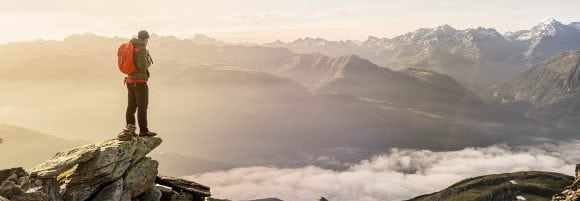 Hiker looking at mountain landscape