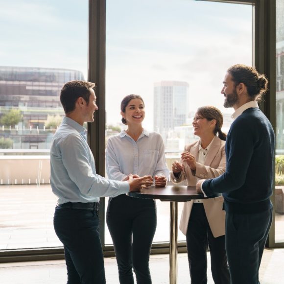 Colleagues talking during break