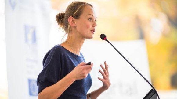 women speaking on mic
