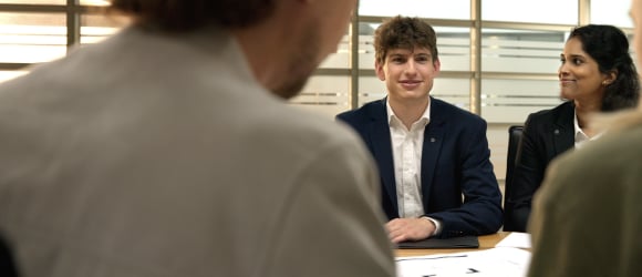 Group of people sitting around a table