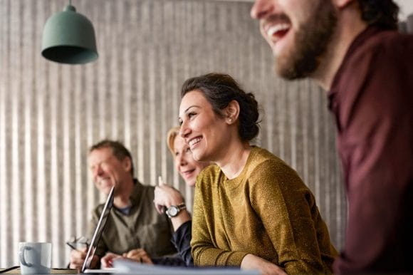 Cheerful colleagues during meeting