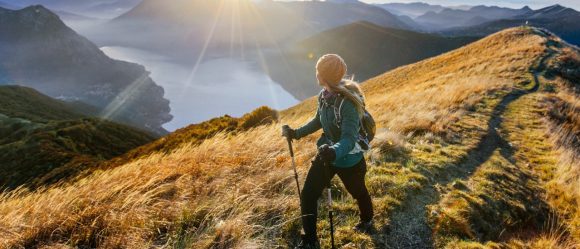 Woman hiking along mountain ridge