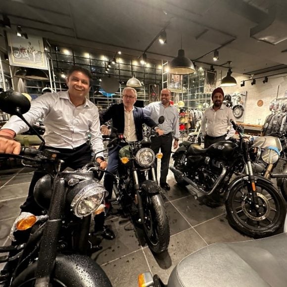 Four UBS employees in a motorbike dealership