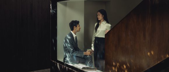 Two young professionals chatting with each other