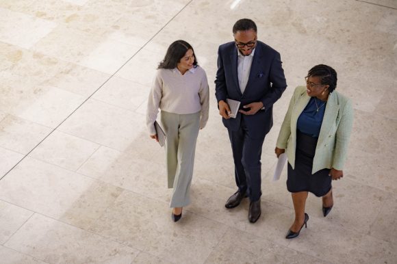 Colleagues talking while walking