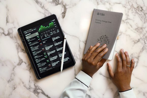 Hands on notepad with pen