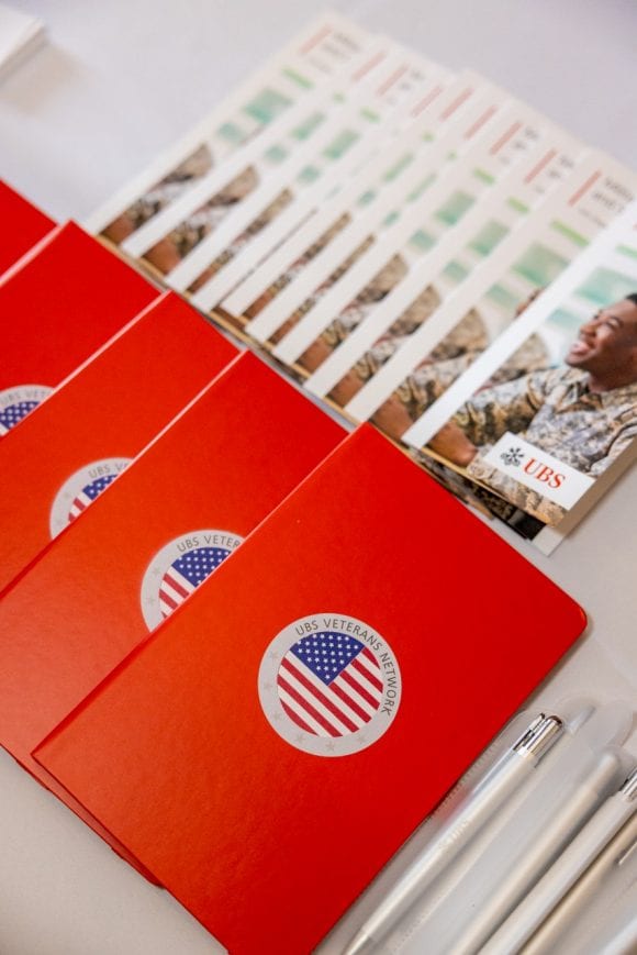 Image with notebooks and brochures for the Veterans programs at UBS