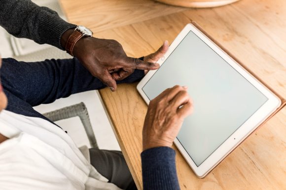 Senior couple checking a tablet computer