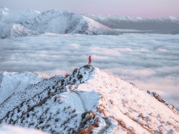 Man standing on a snowy peak