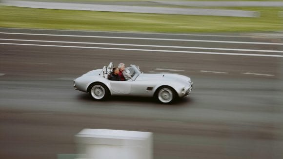 Couple in car racing