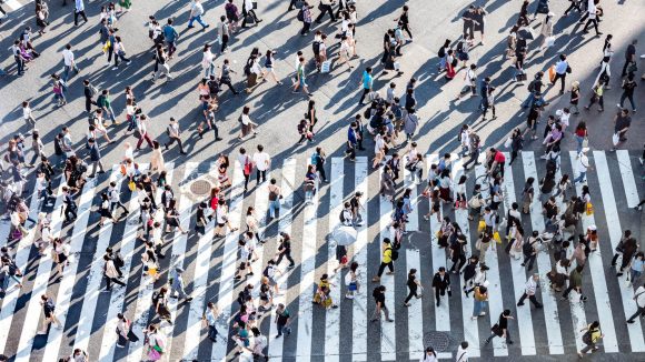 People crowd on road