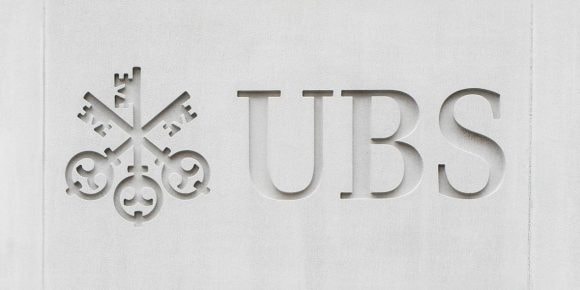 UBS logo carved in gray wall