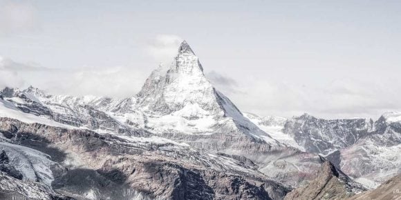 Matterhorn, steep mountain partially covered in snow.