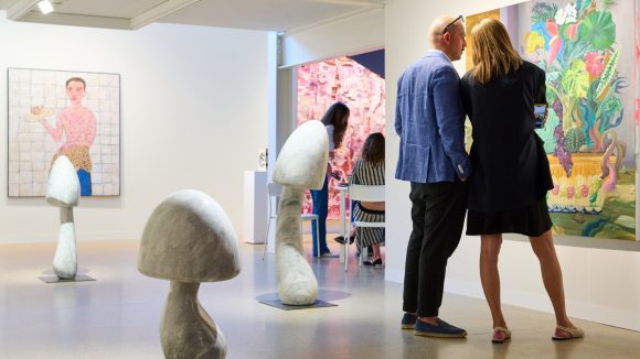 People looking at art in a gallery