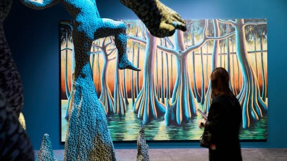 A people looking at a painting