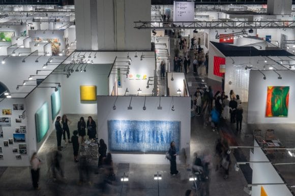 Crowded art gallery interior