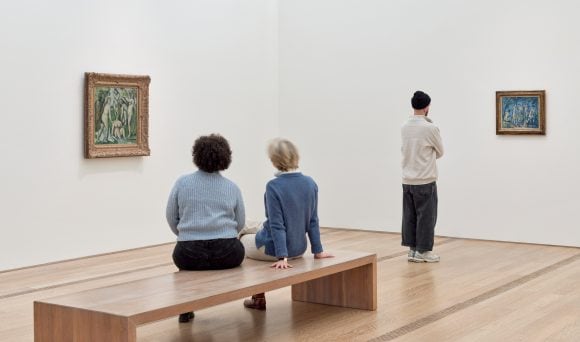 Citywide view with multiple buildings and a promotion board