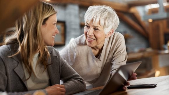Daughter talking to senior mother