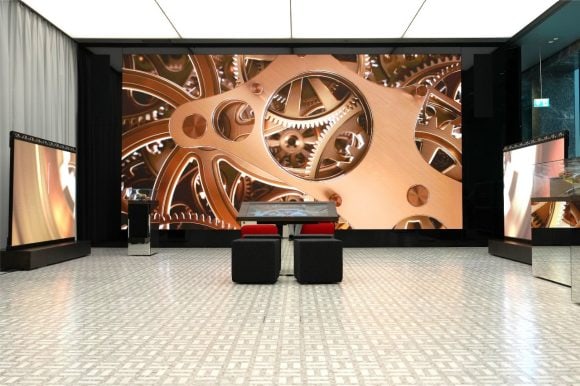 Exhibition space with screen and artifacts