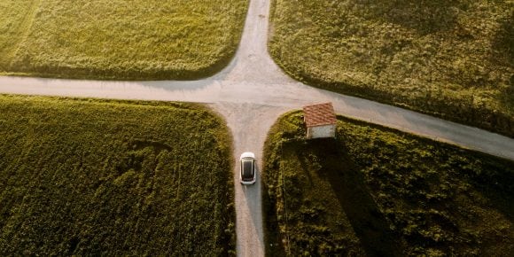 Car at cross roads