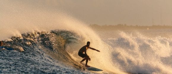 Surfer riding wave