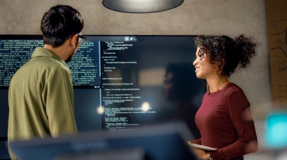 Software engineers discussing project