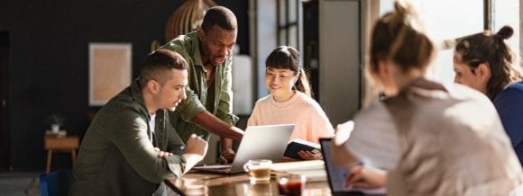 Diverse team having meeting in open workspace
