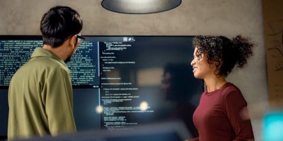 Software engineers discussing project